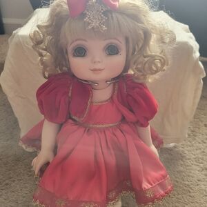 Elegant Red Doll with Bow